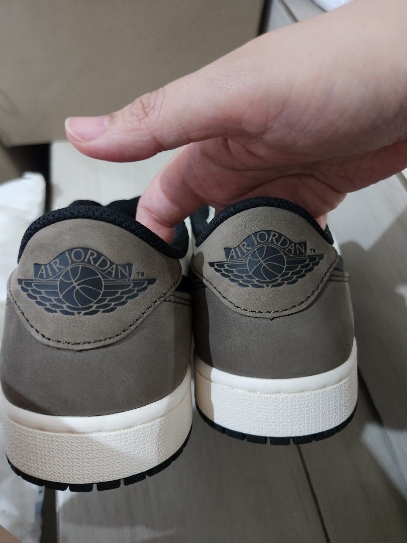 Air Jordan 1 Low OG "Dark Mocha" (Category: Sneakers) located in Paranaque City. Submitted by andim8 (Listing ID 1459755475, Image 2). Description: - Air Jordan 1 Low OG - Colorway: Dark Mocha - Size: US 10 (EU 44) - Material: Premium leather (white, black, mocha brown) - Features: Classic Jordan silhouette, iconic Air Jordan Wings logo on heel - Condition: Brand New.