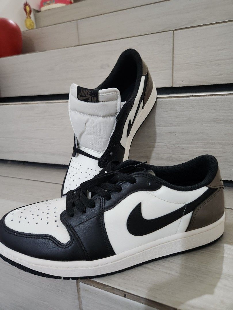 Air Jordan 1 Low OG "Dark Mocha" (Category: Sneakers) located in Paranaque City. Submitted by andim8 (Listing ID 1459755475, Image 1). Description: - Air Jordan 1 Low OG - Colorway: Dark Mocha - Size: US 10 (EU 44) - Material: Premium leather (white, black, mocha brown) - Features: Classic Jordan silhouette, iconic Air Jordan Wings logo on heel - Condition: Brand New.