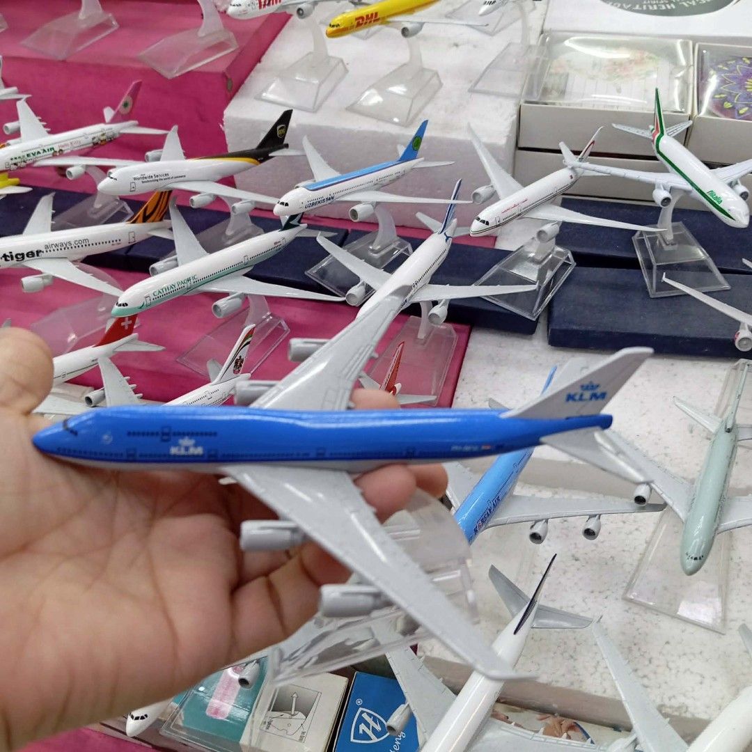 Airplane Model Collection - Various Airlines (Category: Vehicle & Diecast Models) located in Manila. Submitted by iliasjen3082126 (Listing ID 1459817513, Image 2). Description: - Collection of airplane models available. - Brands include MC-21, KLM, ANA, and Bangladesh Airlines. - Perfect for aviation enthusiasts and collectors. - Some models include original packaging. - Display stands are included with select models..
