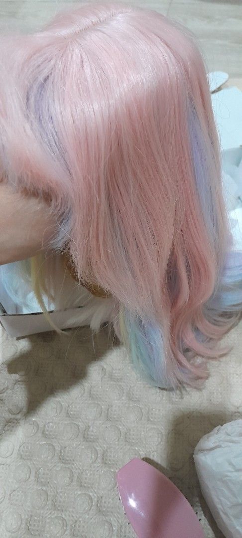 Alice Garden Pastel Rainbow Wig (Category: Hair Accessories) located in Baguio. Submitted by rozel047 (Listing ID 1459897439, Image 3). Description: - Pastel rainbow wig from Alice Garden - Pink base with blue, purple, and green streaks - Soft and wavy texture - Perfect for cosplay or a new look - Comes in original packaging.