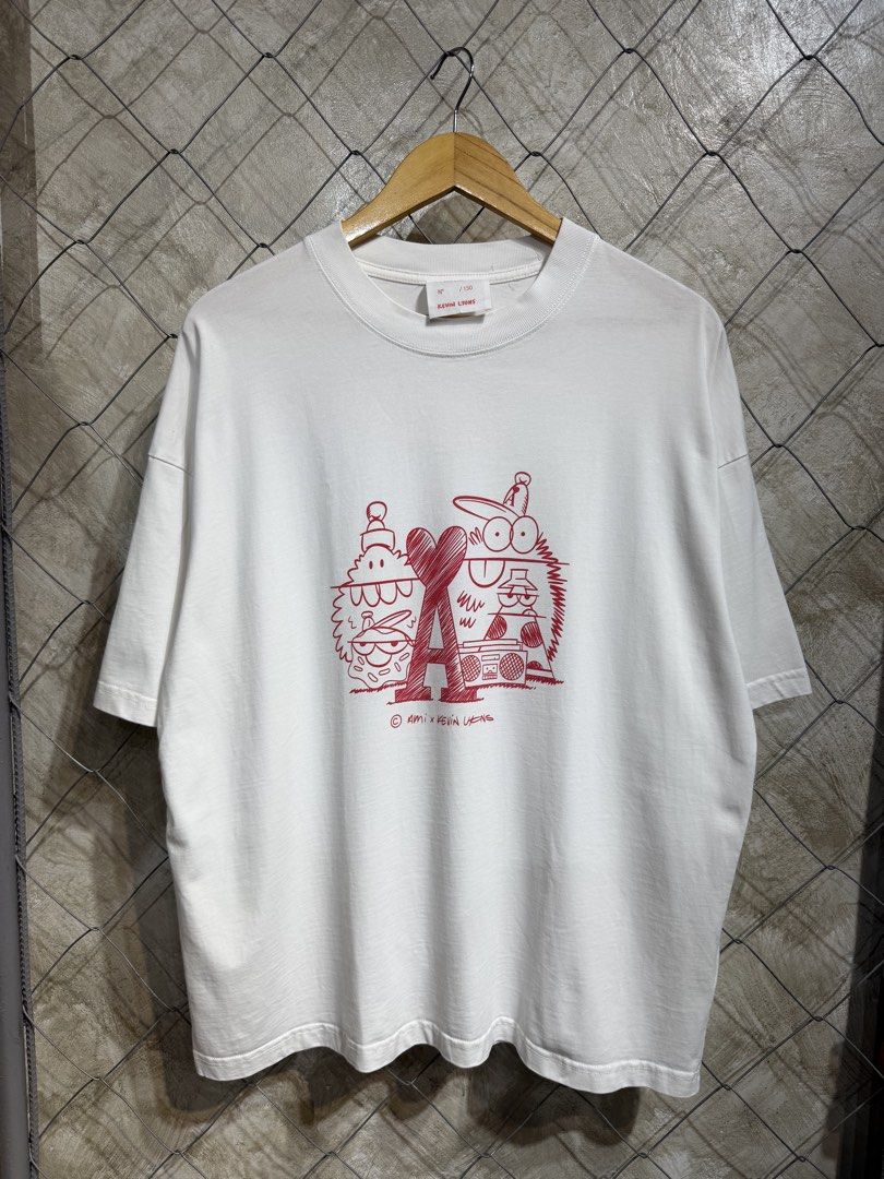 Ami x Kevin Lyons White Tee. (Category: Tshirts & Polo Shirts ) located in Manila. Submitted by ardobe.mnl (Listing ID 1459841209, Image 1). Description: -Ami x Kevin Lyons White Tee. Size: Large-XL Dimes: 23x28.5 Condition: Excellent Flaw: None! Mine: Dm for inquiries! 🛒📥.