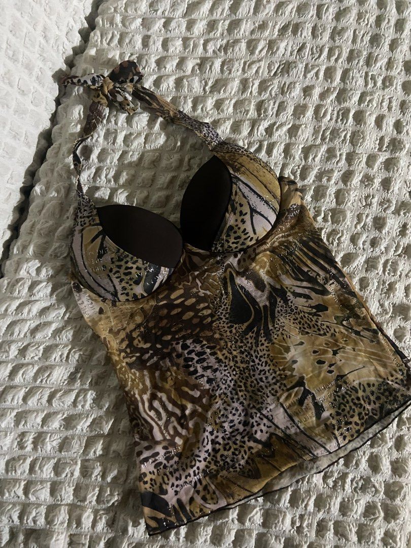 Animal Print Halter Top (Category: Others Tops) located in Cavite. Submitted by shopbygcsnly (Listing ID 1459724443, Image 3). Description: 💌 Extra Small to Small 💌 Has padding 💌 Bought from a swimsuit seller. Only tried on once and never worn outside. 💌 Issue: There are some marks on the pad, possibly from the other swimsuits bleeding color while stored together. 💌 Mine = Sure Buyer! 🪄 💌 No refunds/exchange unless wrong item sent. 💌 Stri