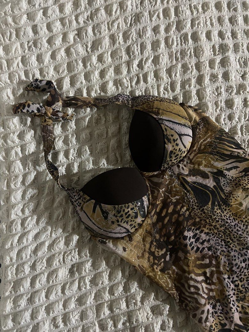 Animal Print Halter Top (Category: Others Tops) located in Cavite. Submitted by shopbygcsnly (Listing ID 1459724443, Image 1). Description: 💌 Extra Small to Small 💌 Has padding 💌 Bought from a swimsuit seller. Only tried on once and never worn outside. 💌 Issue: There are some marks on the pad, possibly from the other swimsuits bleeding color while stored together. 💌 Mine = Sure Buyer! 🪄 💌 No refunds/exchange unless wrong item sent. 💌 Stri