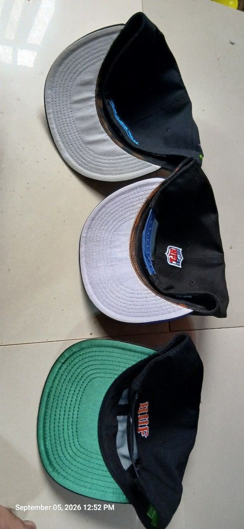 Aspack New Era NBA & NFL Caps (Category: Caps & Hats) located in San Mateo. Submitted by edayz709 (Listing ID 1459733418, Image 2). Description: - Set of 3 adjustable snapback caps, perfect for any sports fan. - Miami Heat NBA cap featuring the iconic flame logo. - Black and blue New Era NFL cap with bold 'Football' text. - Black cap celebrating 'Worldwide 20x Champions'..