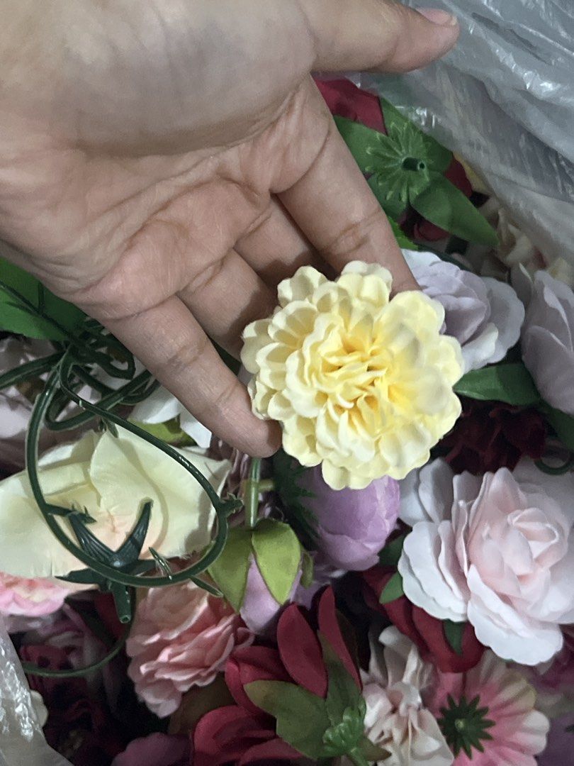 Assorted Artificial Flowers for Crafts and Decorations (Category: Artificial Plants & Flowers) located in Quezon City. Submitted by charlenedv58782 (Listing ID 1459733402, Image 2). Description: - Bundle of artificial flowers in various colors: pink, burgundy, yellow, and white. - Ideal for DIY projects, floral arrangements, and party decorations. - Features a mix of blooms including roses, peonies, and other flower types. - Some flowers come wit
