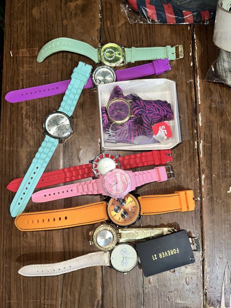 Assorted Silicone Strap Watches Bundle (Category: Women's Watches) located in Manila. Submitted by edgiedge (Listing ID 1459868626, Image 1). Description: - Bundle of 9 watches - Includes 6 colorful silicone strap watches: mint green, purple, light blue, red, pink, and orange - 1 gold-tone watch with a white strap and a black Forever 21 tag - Some watches feature decorative faces - Ideal for everyday wear or as fun, vibrant accessories No batteri