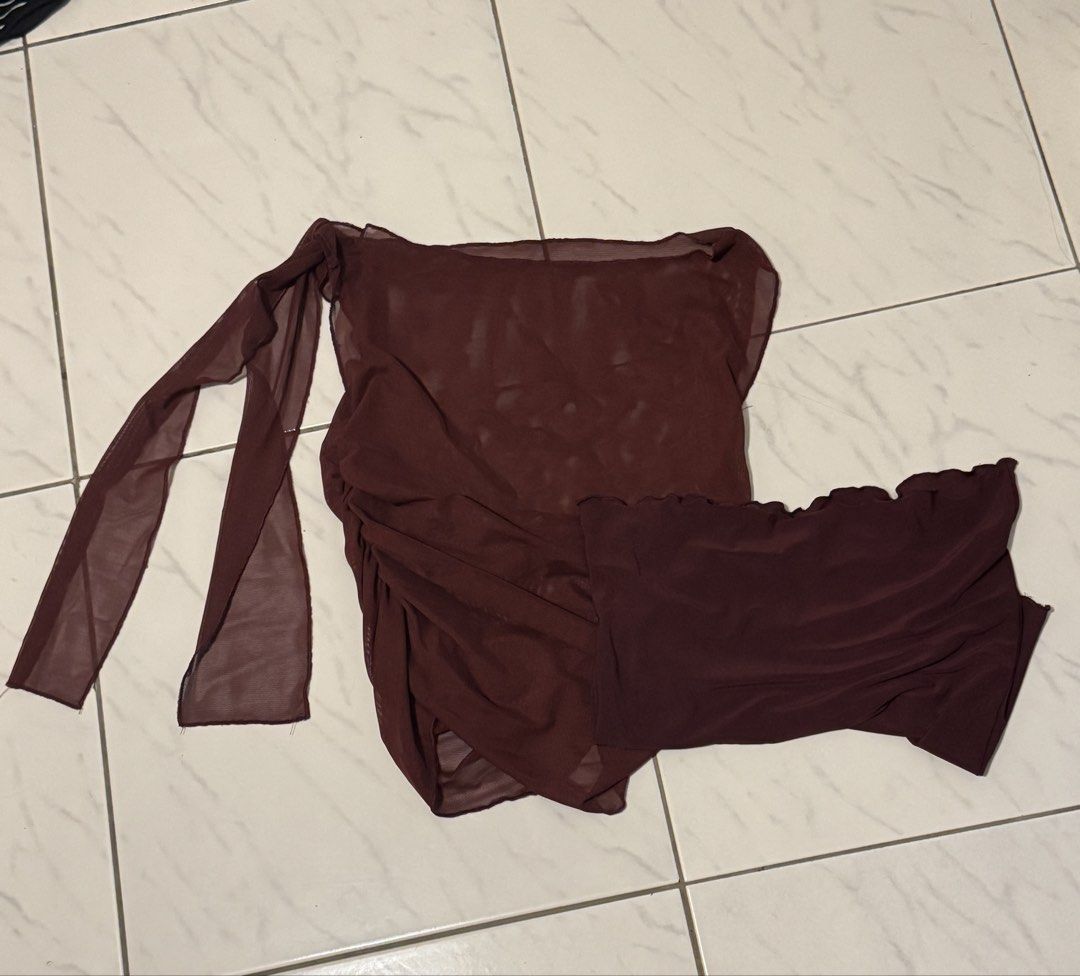 Asymmetrical Mesh and Tube Top (Category: Sleeveless) located in Manila. Submitted by pakissuwu (Listing ID 1459877770, Image 3). Description: - Maroon mesh and tube top - Brand: OLIVIA by OASIS - Asymmetrical design - Features a tie detail on one side - Can be worn off-shoulder - Versatile for night outs or stylish casual looks - Pairs well with jeans or skirts Actual color is a nice maroon worn once lang! Can send more pictures :)).