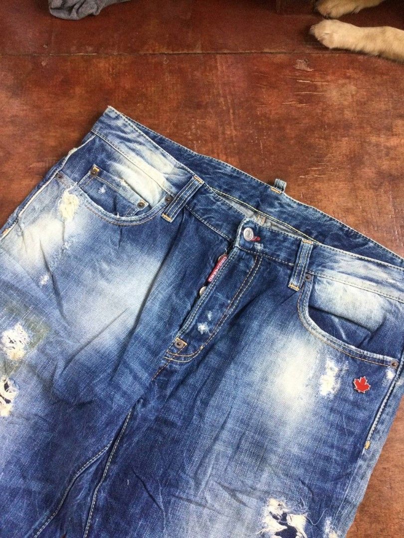 AUTHENTIC ARCHIVE Dsquared2 2010 Red Maple Leaf Patch Distressed Jeans (Made in Italy) (Category: Jeans) located in Butuan. Submitted by the_thrift_bots_ (Listing ID 1459815617, Image 3). Description: - W36 L41 T13 H8.5 - DSQUARED2 Cool Guy Jeans - Blue wash with distressed details and rips - Button fly closure - Made in Italy - Size 42 (check measurements) - Bold statement jeans.