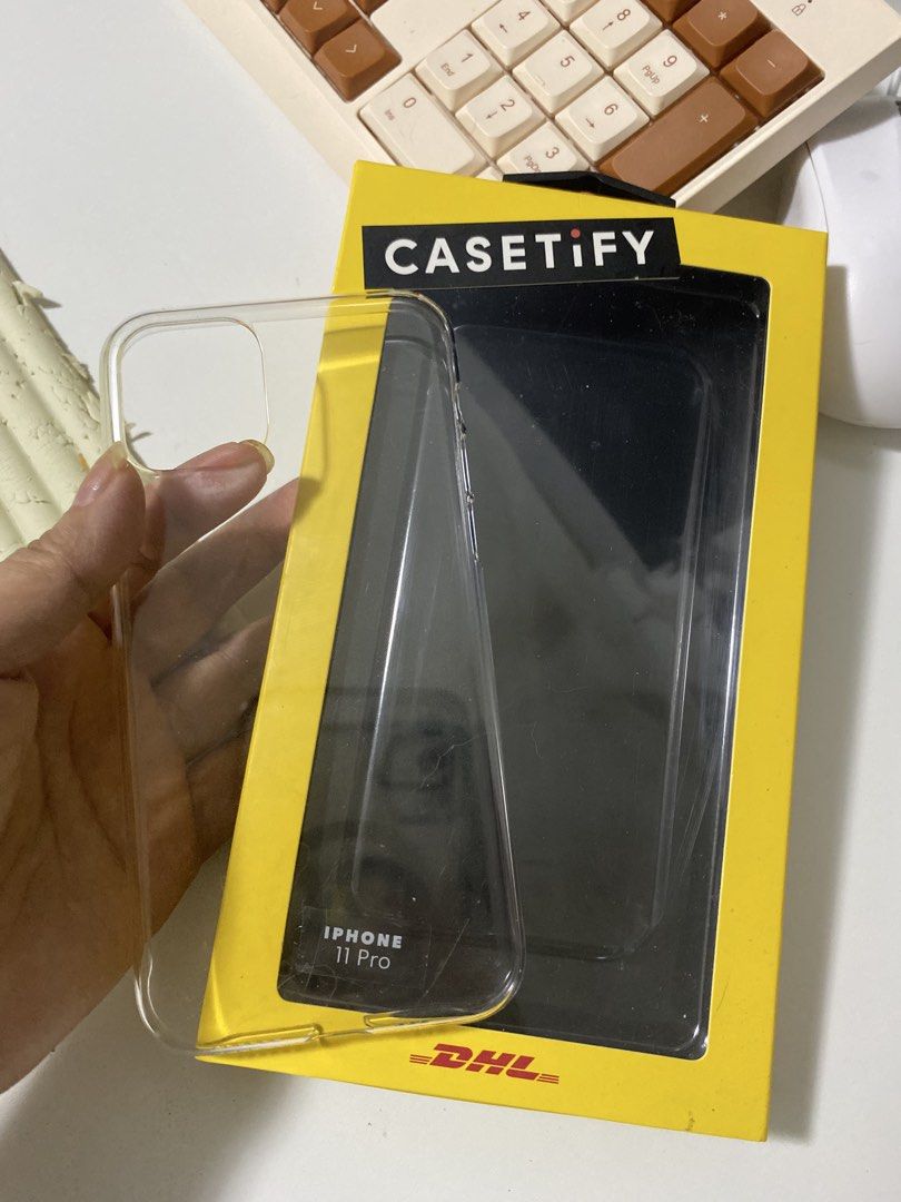 Authentic CASETiFY x DHL Limited Edition iPhone 11 Pro Case Set w/ Box (Category: Cases & Sleeves) located in Bacoor. Submitted by brandedluxuryshop (Listing ID 1459898099, Image 2). Description: Authentic DHL x CASETiFY Limited Edition iPhone 11 Pro Case Set Selling an authentic preloved CASETiFY case from the rare limited-edition DHL collaboration, complete with its original collector’s box! Compatibility: • Fits iPhone 11 Pro Inclusions: • Aut