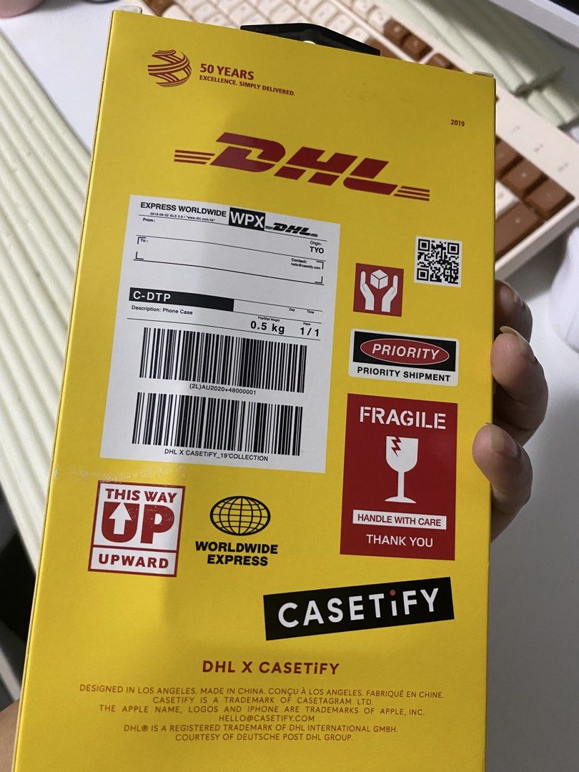 Authentic CASETiFY x DHL Limited Edition iPhone 11 Pro Case Set w/ Box (Category: Cases & Sleeves) located in Bacoor. Submitted by brandedluxuryshop (Listing ID 1459898099, Image 3). Description: Authentic DHL x CASETiFY Limited Edition iPhone 11 Pro Case Set Selling an authentic preloved CASETiFY case from the rare limited-edition DHL collaboration, complete with its original collector’s box! Compatibility: • Fits iPhone 11 Pro Inclusions: • Aut