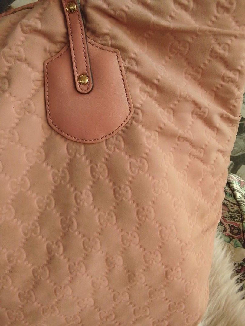 Authentic Gucci Pink GG Monogram Nylon Tote Bag (Category: Luxury Bags & Wallets) located in Bacolod City. Submitted by chuchaystuffs (Listing ID 1459741482, Image 2). Description: - Authentic Pink Gucci Tote Bag - Iconic GG Monogram Pattern - Made in Italy - Genuine Leather Trim and Handles - Interior Zip Pocket for Organization - Ideal Everyday Carryall.