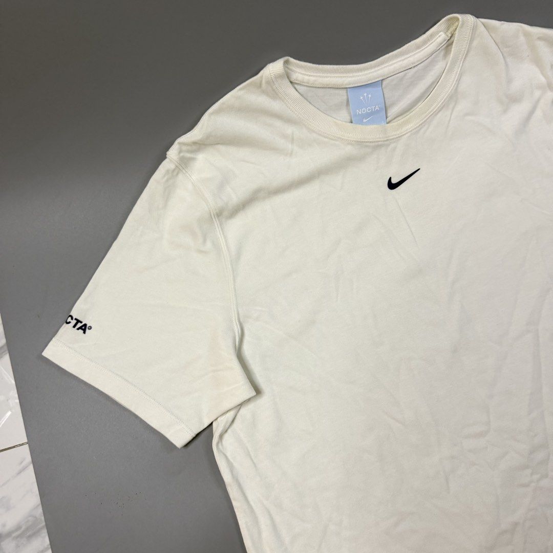 (Authentic) Nike - Nocta Drake Shirt (Category: Tshirts & Polo Shirts ) located in Paranaque City. Submitted by millennial_goodz (Listing ID 1459871653, Image 3). Description: WTS (Authentic) Nike - Nocta Drake Shirt Size Large Dimensions: 19.5" / 27.5" Excellent condition Needs iron only DM.