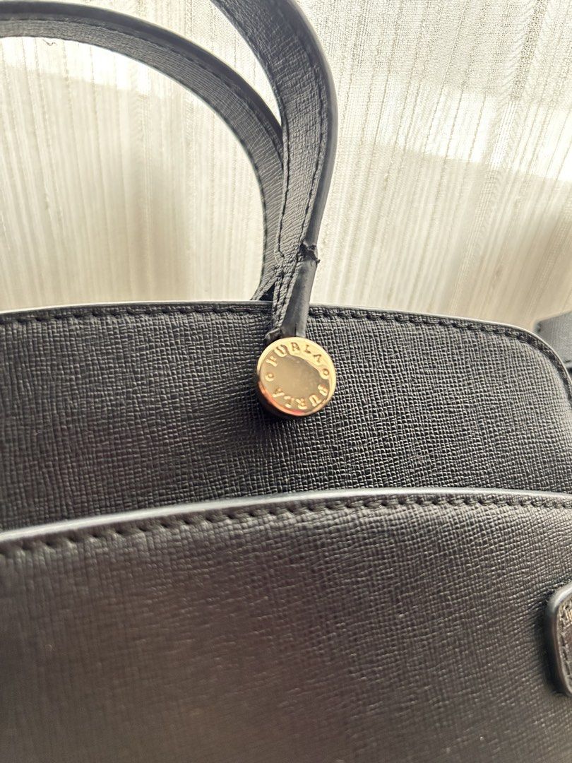 Authentic Piper Black Leather Tote Bag with Shoulder Strap (Category: Luxury Bags & Wallets) located in Santa Rosa. Submitted by jolels (Listing ID 1459693385, Image 2). Description: - Authentic Classic black leather tote by Furla - Bought from Tokyo (Php 20k) -Features top handles and a detachable shoulder strap - Elegant gold hardware details - Spacious interior for all your essentials - Comes with original Furla dust bag - Ideal for everyday u