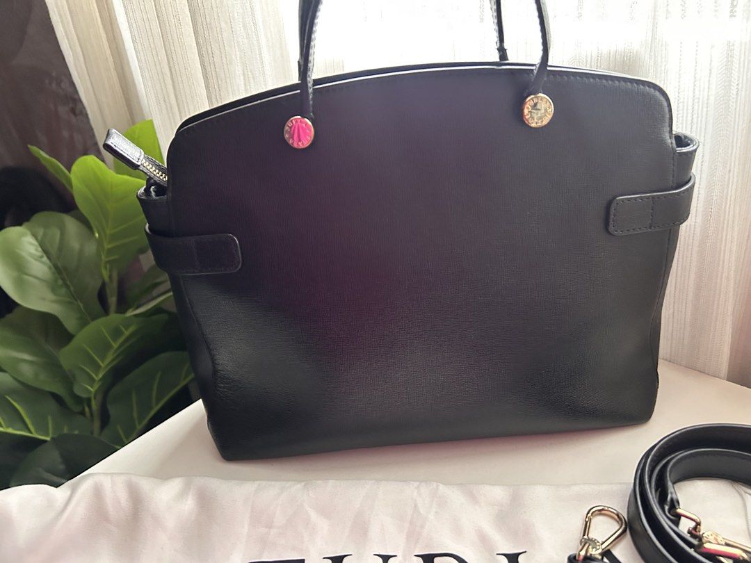 Authentic Piper Black Leather Tote Bag with Shoulder Strap (Category: Luxury Bags & Wallets) located in Santa Rosa. Submitted by jolels (Listing ID 1459693385, Image 3). Description: - Authentic Classic black leather tote by Furla - Bought from Tokyo (Php 20k) -Features top handles and a detachable shoulder strap - Elegant gold hardware details - Spacious interior for all your essentials - Comes with original Furla dust bag - Ideal for everyday u