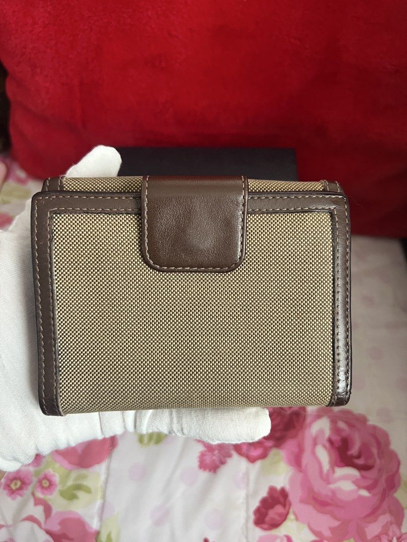 AUTHENTIC PRADA Jacquard Canvas Bow Wallet (Category: Luxury Bags & Wallets) located in Cavite. Submitted by charmscloset888 (Listing ID 1459735633, Image 2). Description: A beautiful PRADA Milano Jacquard Canvas & Leather Bow Wallet in classic beige and brown. 🎀 ✨ Iconic PRADA jacquard canvas ✨ Brown leather trims & bow detail ✨ Embroidered PRADA MILANO branding ✨ Multiple card slots & compartments ✨ Snap-button closure ✨ Timeless design ✨ Incl