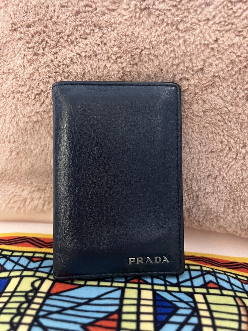 AUTHENTIC PRADA Milano Dark Blue Leather Card Holder (Category: Luxury Bags & Wallets) located in Cavite. Submitted by charmscloset888 (Listing ID 1459753199, Image 1). Description: PRADA Milano Dark Blue Leather Card Holder ₱ 6,500 A classic PRADA Milano card holder in rich dark blue textured leather, featuring the signature raised PRADA lettering in silver-tone hardware. 💙 ✨ Authentic PRADA Milano ✨ Dark blue textured leather ✨ Multiple card s