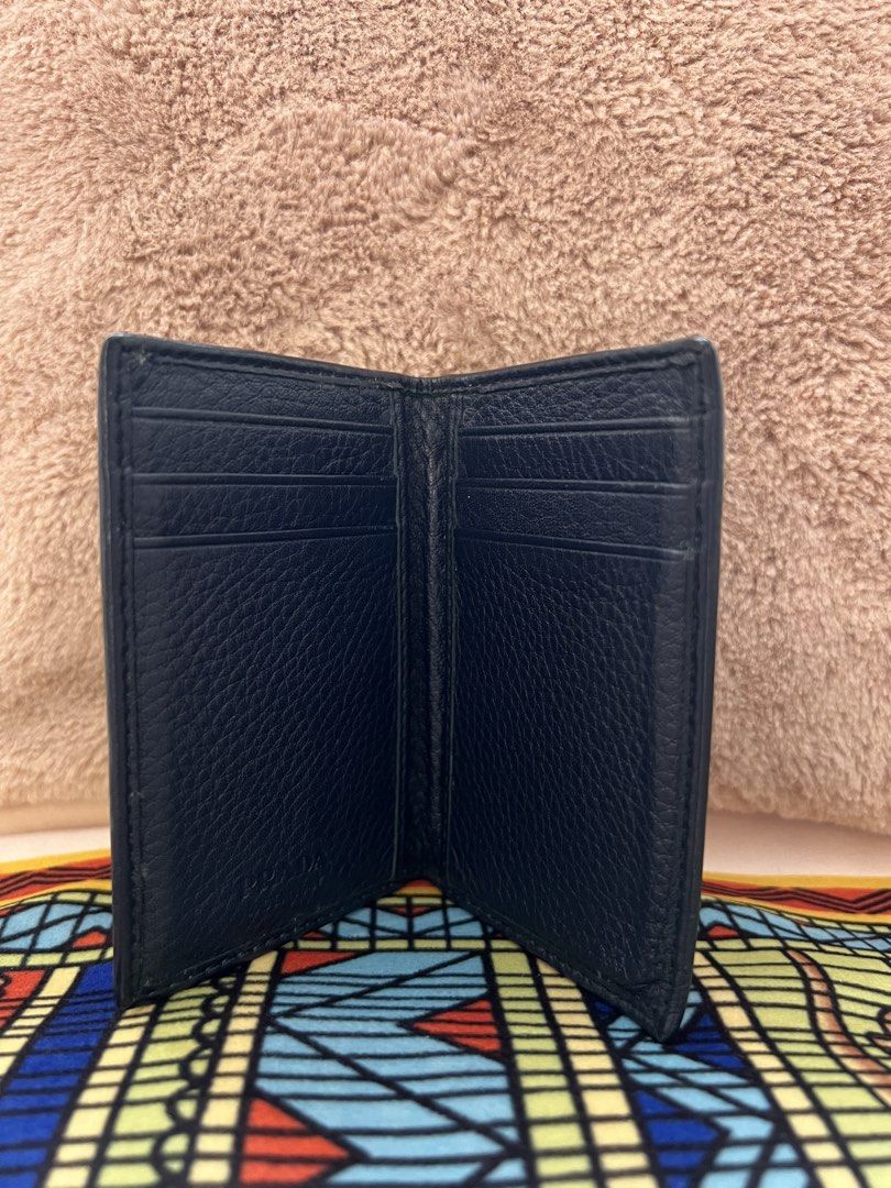 AUTHENTIC PRADA Milano Dark Blue Leather Card Holder (Category: Luxury Bags & Wallets) located in Cavite. Submitted by charmscloset888 (Listing ID 1459753199, Image 2). Description: PRADA Milano Dark Blue Leather Card Holder ₱ 6,500 A classic PRADA Milano card holder in rich dark blue textured leather, featuring the signature raised PRADA lettering in silver-tone hardware. 💙 ✨ Authentic PRADA Milano ✨ Dark blue textured leather ✨ Multiple card s