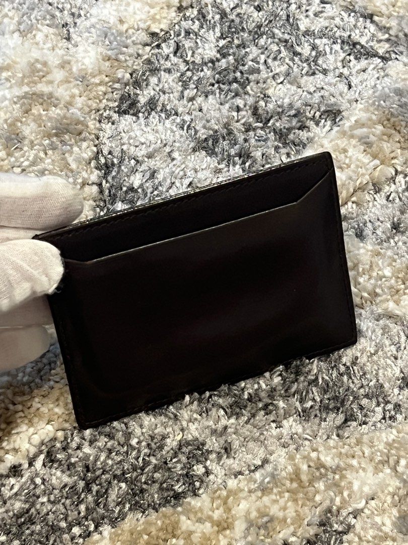 AUTHENTIC PRADA Milano Dark Brown Leather Card Holder (Category: Luxury Bags & Wallets) located in Cavite. Submitted by charmscloset888 (Listing ID 1459755170, Image 3). Description: A classic PRADA Milano card holder in rich dark brown leather, featuring the understated PRADA logo embossed on the front. 🤎 ✨ Authentic PRADA Milano ✨ Dark brown leather ✨ Multiple card slots ✨ Spacious central compartment ✨ Slim and practical design ✨ Made in Ital
