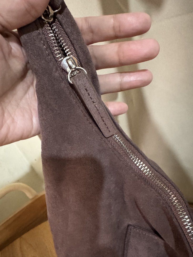 AZTRID Suede Hobo Bag (Category: Shoulder Bags) located in Quezon City. Submitted by areux (Listing ID 1459773723, Image 3). Description: A roomy and stylish everyday bag with a soft suede-like finish and adjustable strap. The neutral gray-brown/taupe shade is easy to pair with almost any outfit, whether casual or dressed up. ✨ Features: • Large hobo/sling bag design • Can be worn as a shoulder or crossbody bag • Adjustable strap with multiple ho