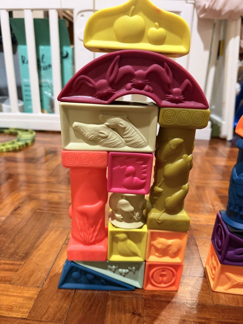 B. toys Soft Architectural Blocks (Category: Educational & Learning Toys) located in Quezon City. Submitted by eimaj08 (Listing ID 1459852131, Image 3). Description: - Fun set of soft building blocks for little ones. - Features various shapes and textures. - Embossed with animals, numbers, and patterns. - Made of soft, squeezable material. - Includes a zippered clear bag for easy storage. - Ideal for sensory play and developing motor skills..