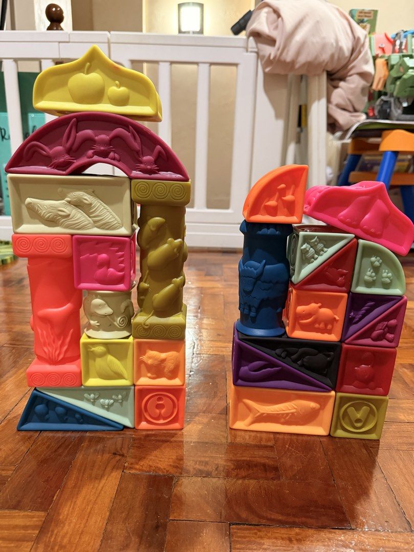 B. toys Soft Architectural Blocks (Category: Educational & Learning Toys) located in Quezon City. Submitted by eimaj08 (Listing ID 1459852131, Image 2). Description: - Fun set of soft building blocks for little ones. - Features various shapes and textures. - Embossed with animals, numbers, and patterns. - Made of soft, squeezable material. - Includes a zippered clear bag for easy storage. - Ideal for sensory play and developing motor skills..
