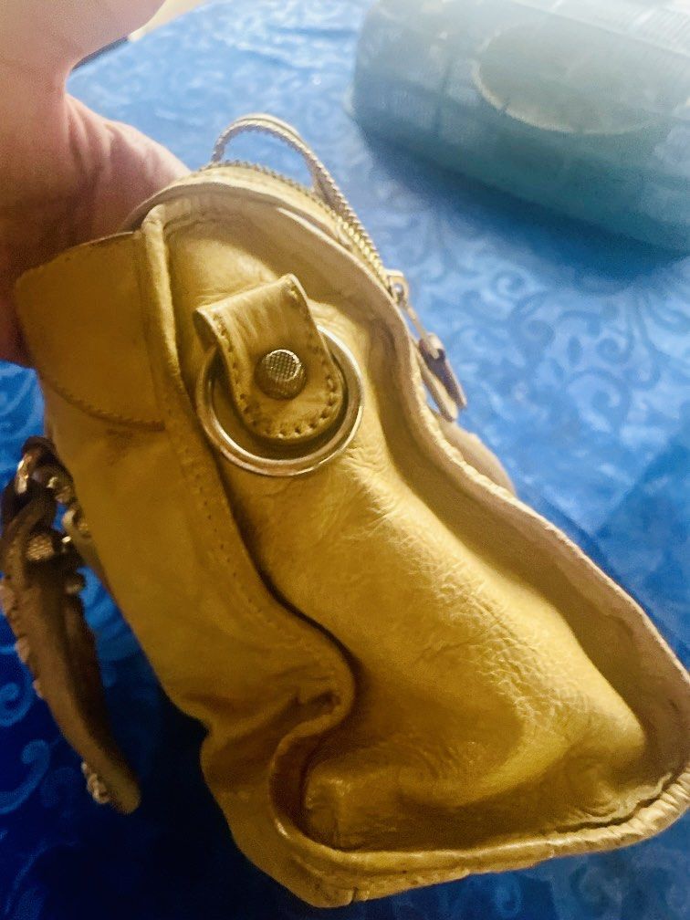 Balenciaga City Bag (Category: Luxury Bags & Wallets) located in Caloocan City. Submitted by hardestea2026 (Listing ID 1459697994, Image 2). Description: - Authentic Yellow Balenciaga City Bag - Features classic front zip pocket - Braided, leather-wrapped handles - Signs of wear on leather and hardware, adding character - Perfect for everyday use - Comes with original dust bag.