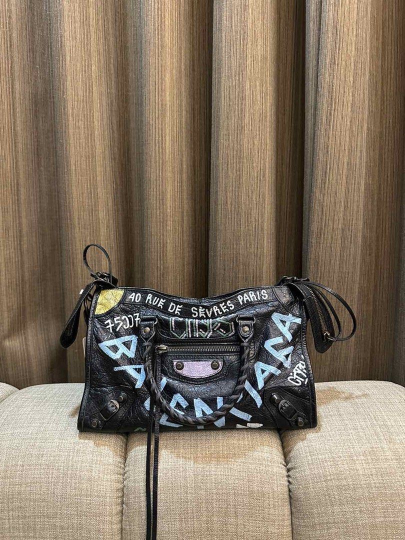 Balenciaga City Graffiti (Category: Luxury Bags & Wallets) located in Navotas City. Submitted by heiresslovecloset (Listing ID 1459798299, Image 1). Description: Balenciaga City Graffiti Year:2017 Comes with Entrupy,& Dustbag .