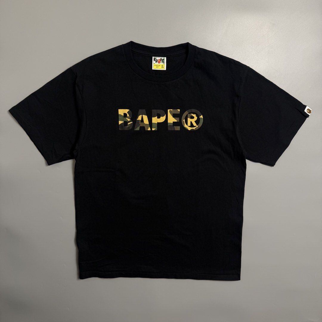 Bape Spell Out First Camou ASNKA Tee (Category: Tshirts & Polo Shirts ) located in Cebu City. Submitted by inukaybyjlf (Listing ID 1459696982, Image 1). Description: Condition: Good as new Issue: No flaws Dimension: Nasa Photos Best fit: L-XL Please refer to photos for actual condition..