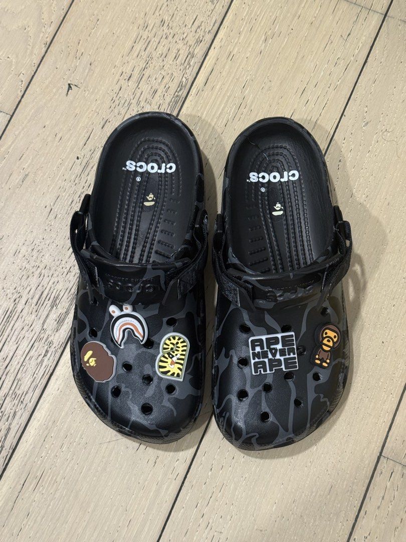 BAPE x Crocs Camo Clogs with Charms (Category: Slippers & Slides) located in Quezon City. Submitted by alphonse13 (Listing ID 1459788969, Image 1). Description: - Class A BAPE Camo Crocs - Size: 9 Men's / 11 Women's - Includes exclusive Jibbitz: APE, BAPE Shark, Tiger - Bought in Malaysia for 100 MYR - Slightly negotiable.