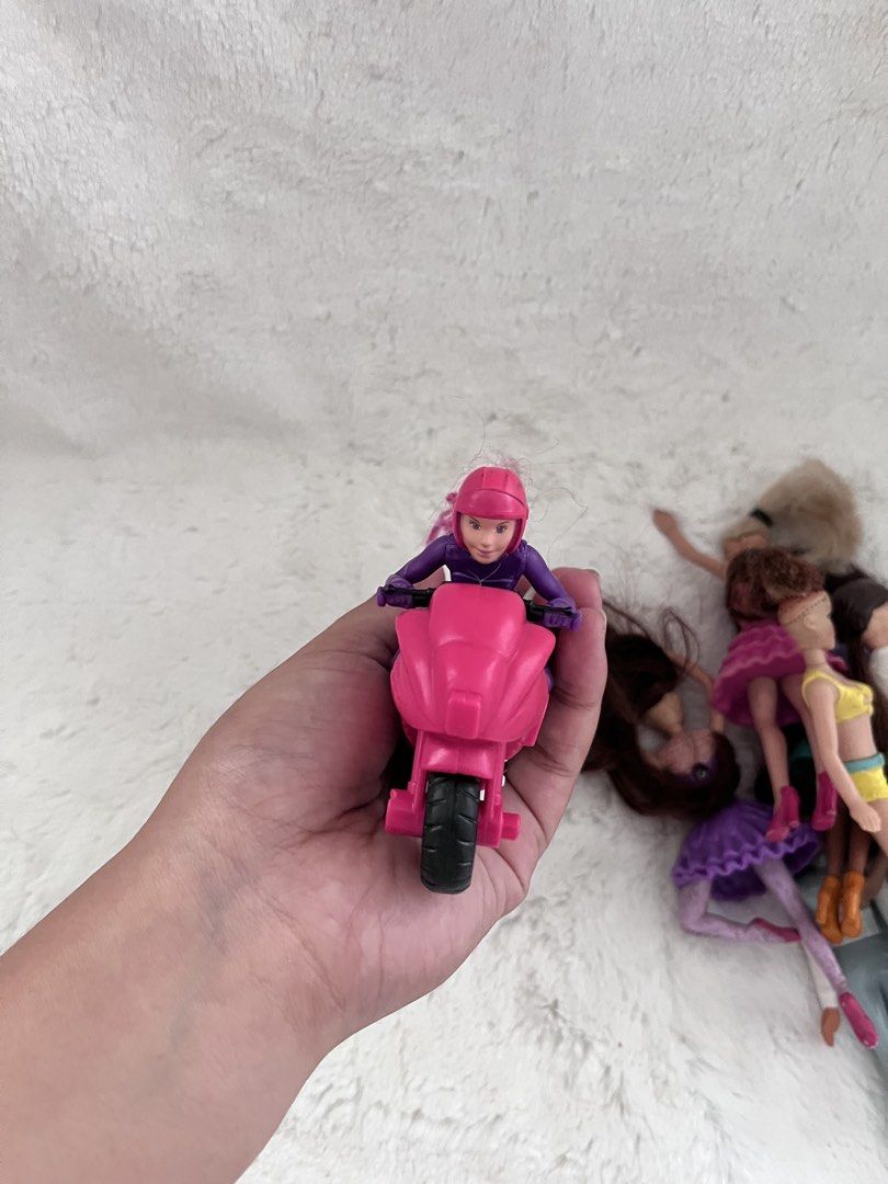 Barbie x Mcdonalds (Category: Kids Toys) located in Zamboanga. Submitted by wilthearey91043 (Listing ID 1459719317, Image 2). Description: - Bundle of assorted dolls and accessories - Includes a pink motorcycle with rider - Features a vet doll with a pet - Assorted fashion dolls with unique hairstyles and shoes - Great for imaginative and creative play.