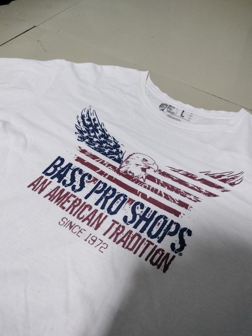 Bass Pro Shops "An American Tradition" Eagle Graphic Tee (Category: Tshirts & Polo Shirts ) located in San Mateo. Submitted by jhaixsober (Listing ID 1459881283, Image 2). Description: DIMES LENGTH 29 WIDTH 23 -GOOD CONDITION -NO ISSUES -COLOR RATE 10/10 -NEED WASH -FRESH FROM BALE LOCATION: QUEZON CITY COURIER:J&T AND LALAMOVE MOP: GCASH ONLY.