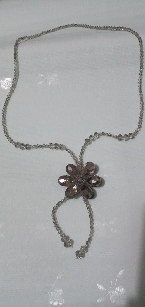 Beaded Necklace with Flower Pendant (Category: Necklaces) located in Paranaque City. Submitted by zuprocsejon38604 (Listing ID 1459721549, Image 1). Description: - Delicate beaded necklace with a subtle sparkle. - Features a pretty flower pendant at the center. - Made with small, clear beads and a faceted bead pendant. - Ideal for everyday wear or to elevate any outfit. - Wonderful gift idea..