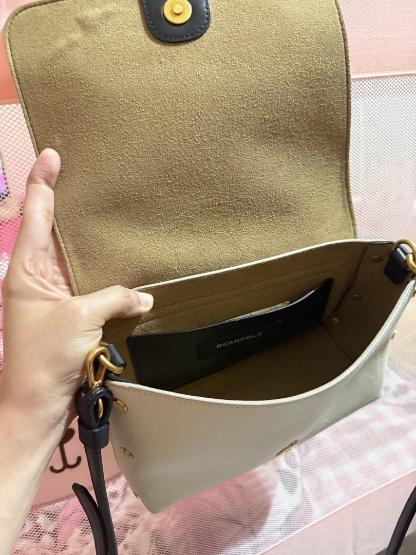 BEANPOLE white Leather Crossbody Bag (Category: Cross-body Bags) located in Obando. Submitted by rizellejen (Listing ID 1459756030, Image 3). Description: - Cream leather crossbody bag by Beanpole - Elegant gold hardware details - Convenient interior card slot - Secure magnetic snap closure - Adjustable strap for comfortable wear - Versatile for daily use or nights out - Interior and exterior are clean.