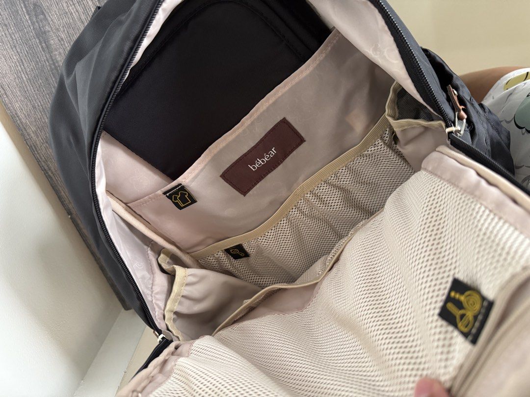 BebeAR Black Diaper Backpack with Changing Pad (Category: Diaper Bags & Wetbags) located in Manila. Submitted by swiftmoon_2cf635 (Listing ID 1459757804, Image 2). Description: - BebeAR black diaper backpack - Multiple compartments for easy organization - Includes padded changing mat with cute bear pattern - Smooth working zippers - Adjustable, padded straps for comfort - Ideal for parents on the go Used once as airport handcarry bag. Top handle 