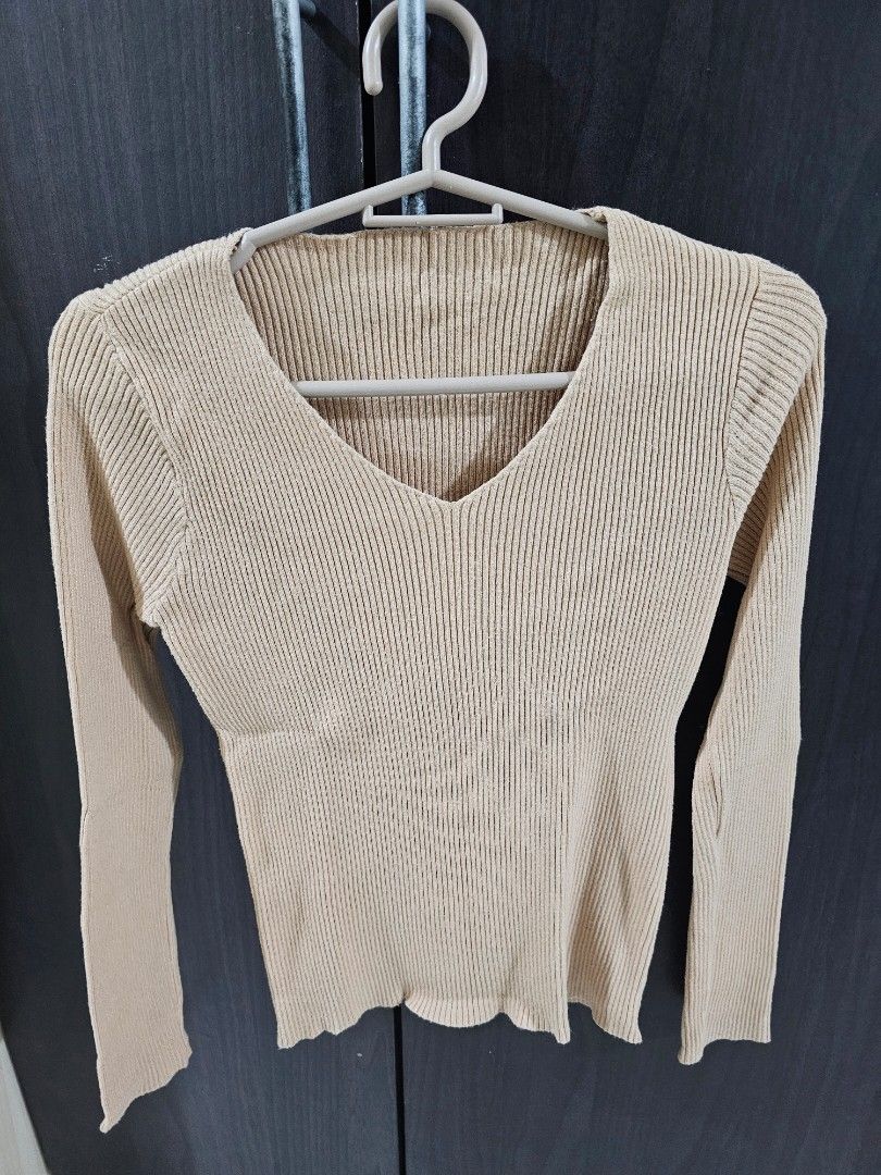 Beige Ribbed Knit Long Sleeve Top (Category: Longsleeves) located in Marilao. Submitted by ____jnsk (Listing ID 1459875376, Image 1). Description: - Beige ribbed knit fabric - Long sleeves - V-neck cut - Stretchy and comfortable material - Perfect for layering or wearing solo - Ideal for casual outfits.
