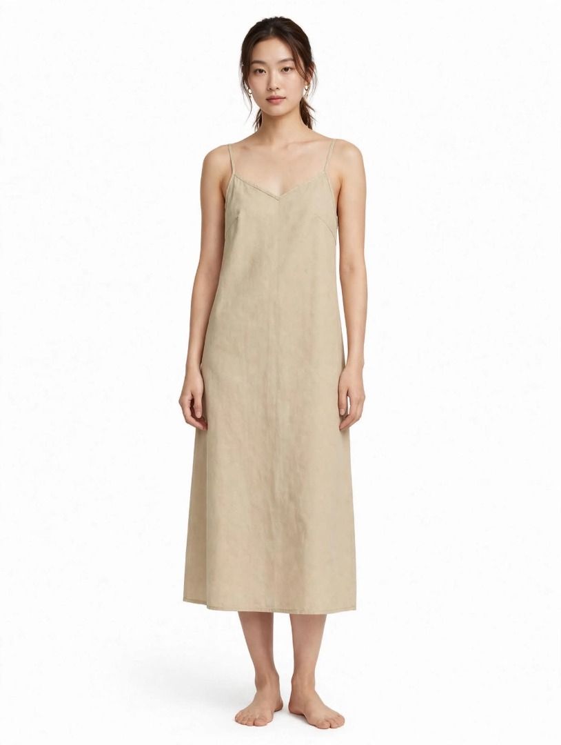 Beige Spaghetti Strap Midi Dress#8 (Category: Dresses) located in Caloocan City. Submitted by outfitloop (Listing ID 1459792466, Image 1). Description: - Simple beige midi dress - Spaghetti straps - Flattering V-neckline IMPORTANT: • 1st photo is an AI styling/model preview for reference on how the item may look when worn. • Please refer to the actual photos for the item’s true appearance and condition. • Color may slightly vary due to lighting, 