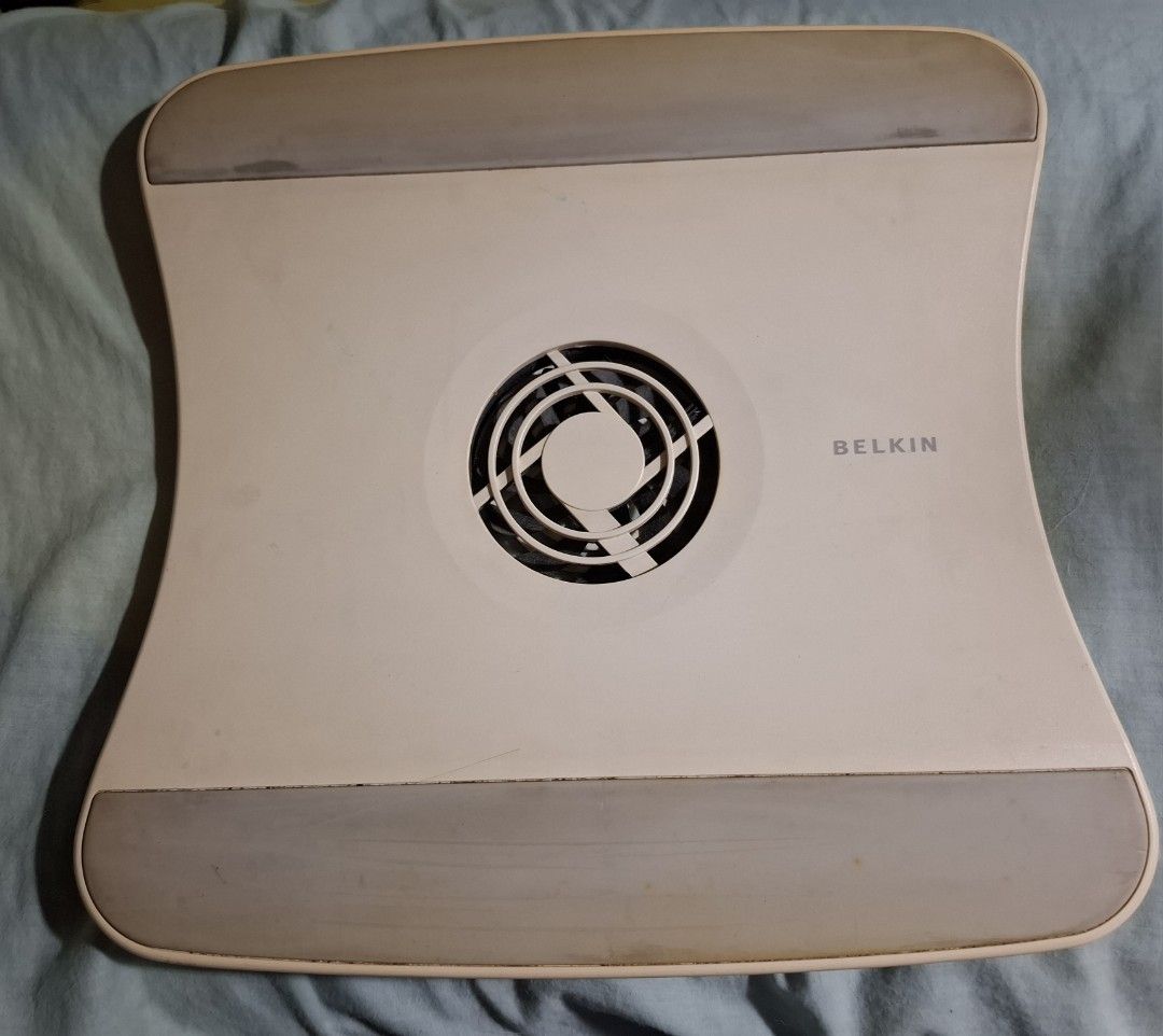 laptop stand (Category: Other Accessories) located in Antipolo. Submitted by cychiyo (Listing ID 1459891198, Image 1). Description: Belkin laptop stand with cooling fan - off-white with grey accents -original Belkin -Keep your laptop cool with a built-in fan. - USB powered (cable included) to use cooling fan - Adjustable stand for optimal viewing angles. - Minor scuffs from normal use. - Fully functional and works great. -solid, sturdy -can hold 