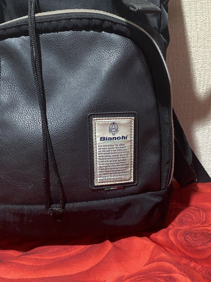 Bianchi Black Backpack (Category: Backpacks) located in Manila. Submitted by cdb_22 (Listing ID 1459819245, Image 3). Description: - Black Bianchi backpack - Multiple zippered pockets - Main compartment with drawstring closure - Buckle straps on front flap - Made of faux leather and nylon - Ideal for everyday use or travel.