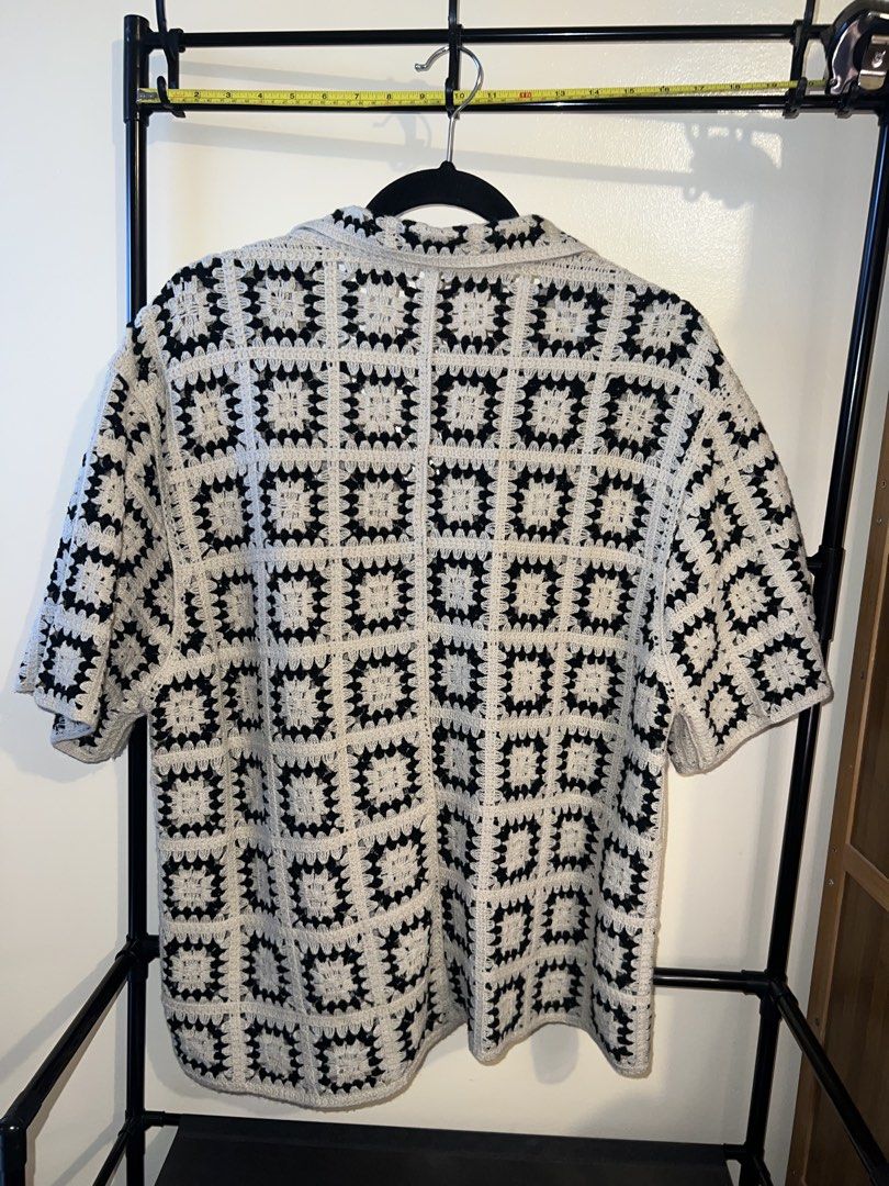Black and White Crochet Button-Up Shirt (Category: Tshirts & Polo Shirts ) located in Mandaluyong City. Submitted by chelseayb47224 (Listing ID 1459815953, Image 2). Description: - Unique handmade short-sleeve crochet shirt - Classic black and white granny square pattern - Features a button-up front and collar - Estimated size: Medium to Large - Ideal for casual outfits or as a layering piece.