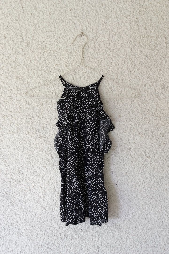 Black and White Patterned Cold Shoulder Top (Category: Blouses) located in Caloocan City. Submitted by kccloset_ (Listing ID 1459799408, Image 1). Description: Cute black and white patterned top. It has a cold shoulder design with ruffled sleeves. The straps are thin and adjustable. The fabric is lightweight and flowy. Great for a casual day out or a night out with friends. Easy to pair with jeans or shorts..