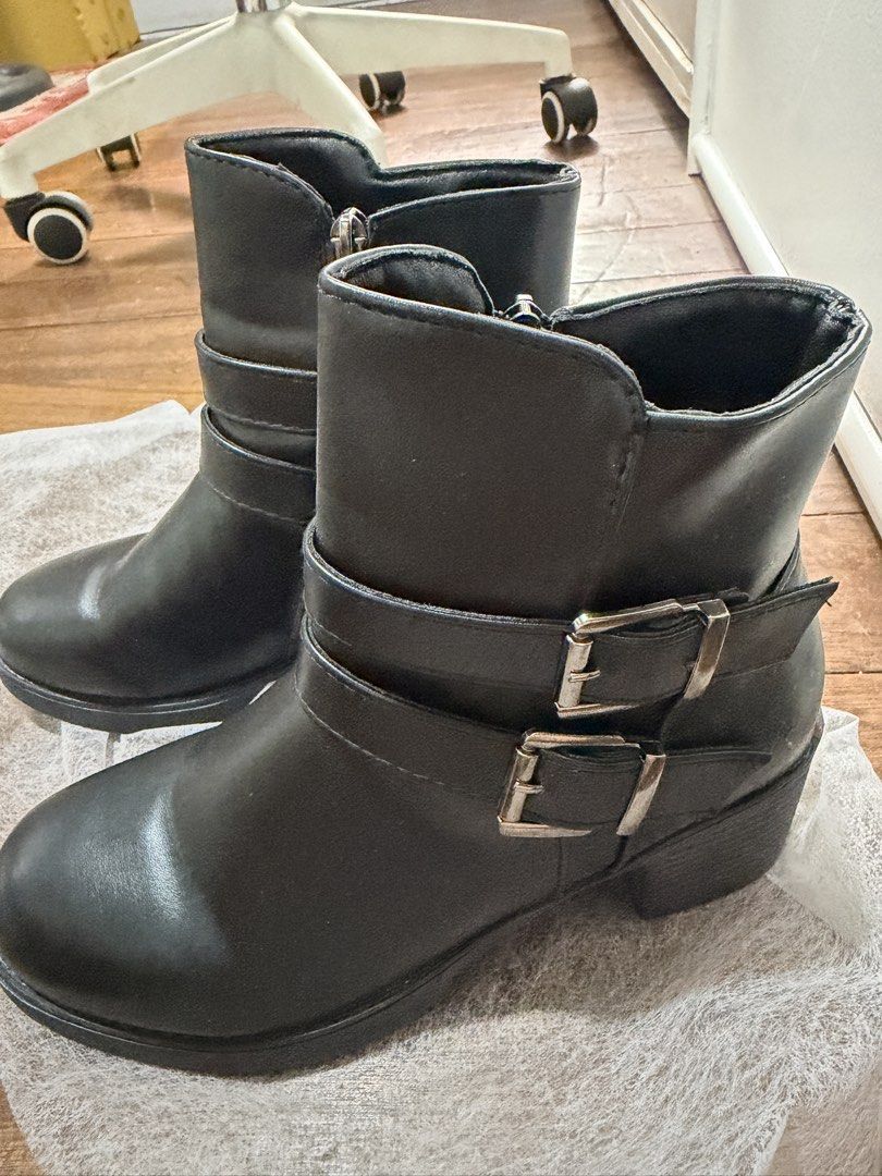 Black Belted Boots (Category: Boots) located in Manila. Submitted by niks_preloved (Listing ID 1459734233, Image 2). Description: Black Belted Boots made with soft PU leather good for everyday wear! Used once only for a party. Size: 23cm but fits 22cm feet too! BRAND: Lovito but this item is already sold-out in the Orange app! .