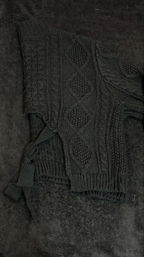 Black Cable Knit V-Neck Cropped Sweater Self-Tie (Category: Coats, Jackets and Outerwear) located in Pasig City. Submitted by kimberlytorralba (Listing ID 1459854393, Image 2). Description: - Intricate cable patterns - Long sleeves with ribbed cuffs - No issues - Dm for more pics if ever - Fits XS-S - MOP: GCash/Maya/GoTyme - MOD: Lalamove/Moveit/Angkas (c/o buyer).