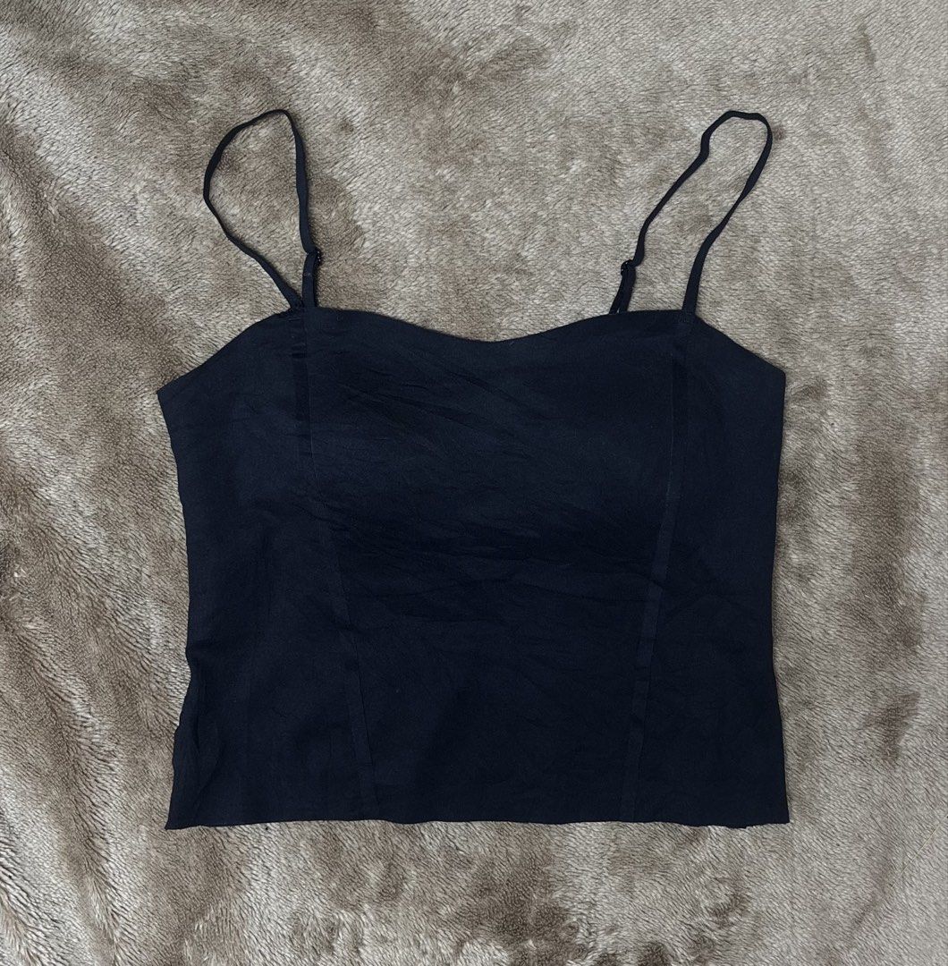 Black Cami Top with Adjustable Straps (Category: Sleeveless) located in Cavite. Submitted by bellewii (Listing ID 1459851801, Image 1). Description: - Classic black cami top - Adjustable spaghetti straps for a perfect fit - Fabric with a subtle sheen - Structured bust area for support and shape - Versatile piece: great for layering or as a standalone top.