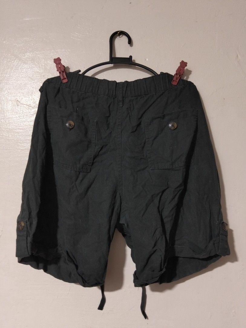 Black Cargo Shorts with Drawstring Waist (Category: Shorts) located in Manila. Submitted by oddhorse_8ada97 (Listing ID 1459752188, Image 3). Description: - Dark grey cargo shorts - Comfortable drawstring waist - Multiple practical pockets - Adjustable roll-up hem with button closure - Ideal for everyday casual outings.
