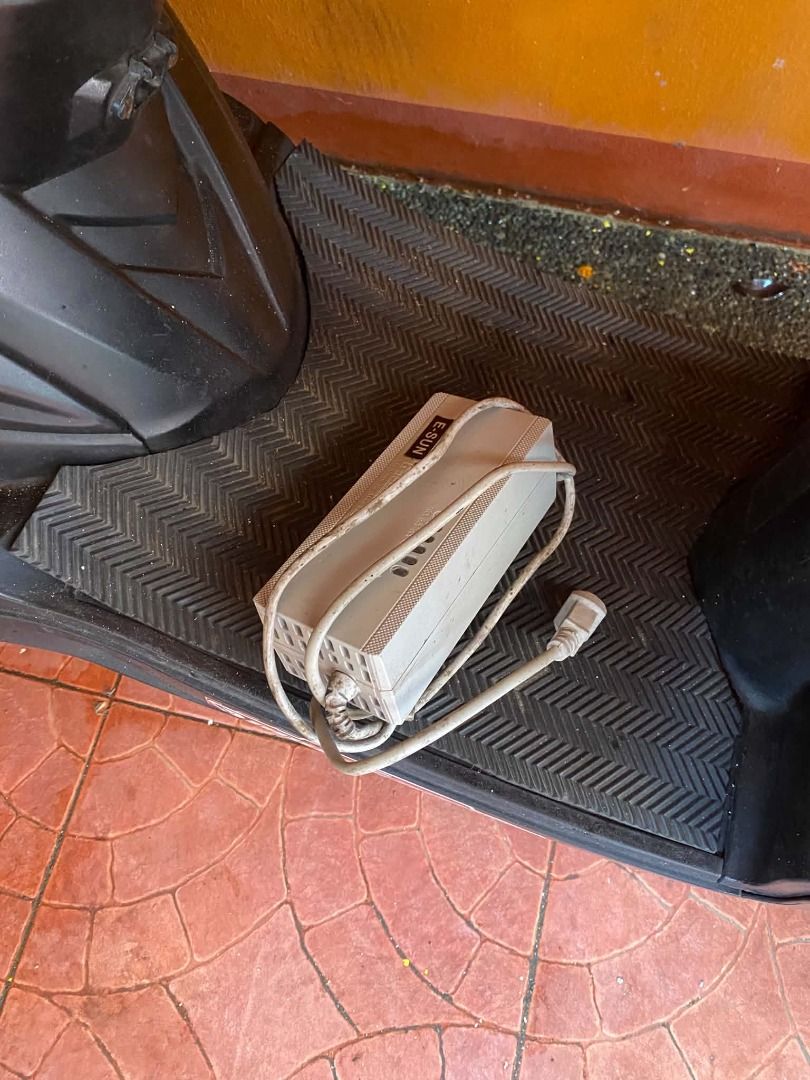 Black Electric Scooter with Charger (Category: Skates, Rollerblades & Scooters) located in Bacoor. Submitted by jmb.mktg0831 (Listing ID 1459735163, Image 3). Description: - Sleek black electric scooter - Includes charger - Comfortable brown patterned seat - Unique stickers on the body - Ready to ride, perfect for getting around town - Negotiable.
