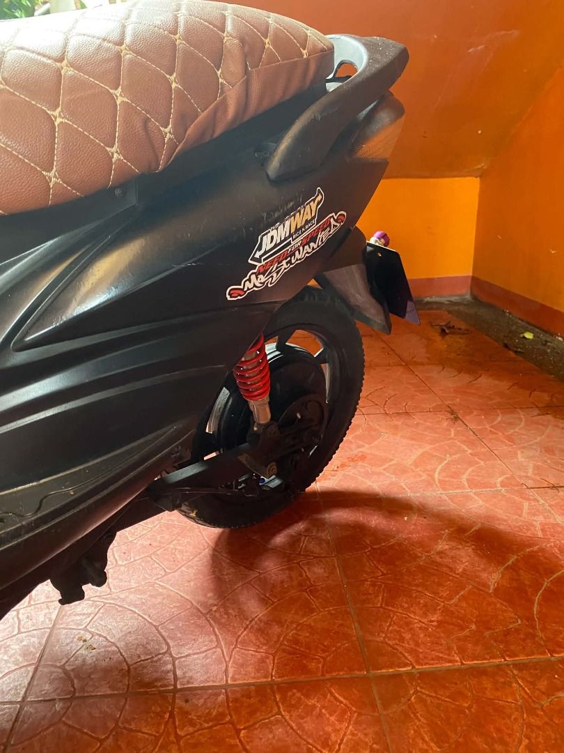 Black Electric Scooter with Charger (Category: Skates, Rollerblades & Scooters) located in Bacoor. Submitted by jmb.mktg0831 (Listing ID 1459735163, Image 2). Description: - Sleek black electric scooter - Includes charger - Comfortable brown patterned seat - Unique stickers on the body - Ready to ride, perfect for getting around town - Negotiable.