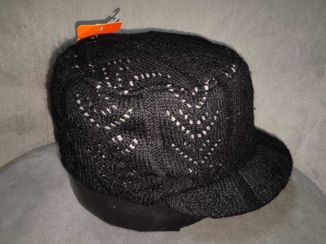 Black Knit Cadet/Military Style Cap (Category: Hats & Beanies) located in Binangonan. Submitted by yuristalin888 (Listing ID 1459826417, Image 3). Description: This cozy black knit cadet/military-style cap features a textured knit pattern with subtle grey speckling, a flat-top crown, and a curved brim. It is uniquely accented on the side with three decorative buttons in contrasting colors secured by looped cords..