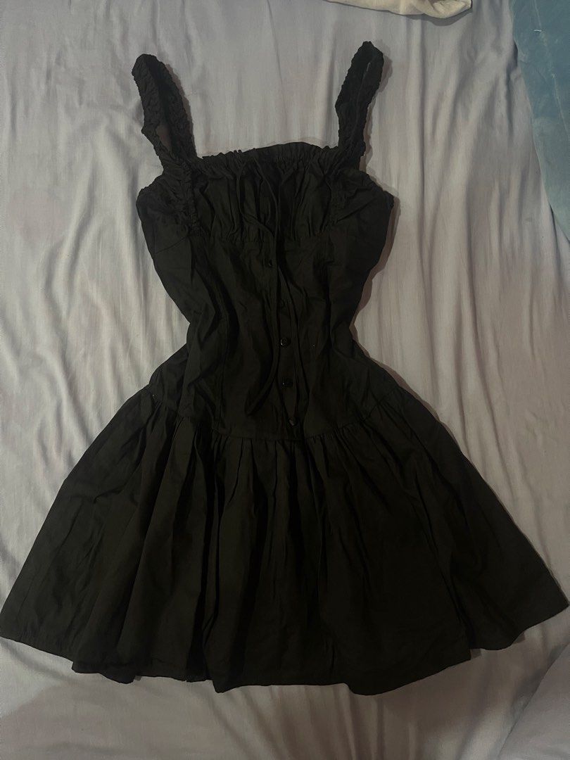 Black Ruched Bust Button Front Mini Dress (Category: Dresses) located in Manila. Submitted by lishhaa (Listing ID 1459739875, Image 1). Description: - Cute black mini dress - Ruched bust with button front - Ruched straps - Flared skirt with pleats - Versatile for casual or dressed-up looks never used .