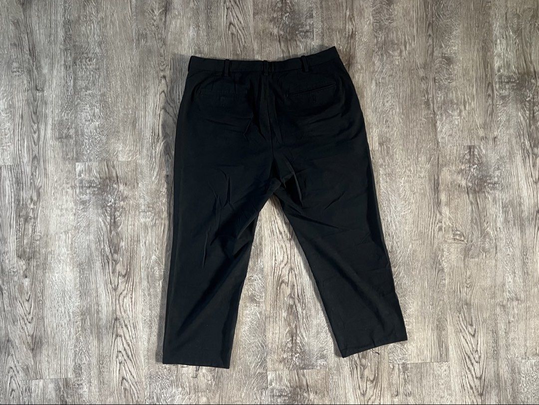 Uniqlo Black Tailored Trousers (Category: Trousers) located in Cebu City. Submitted by rap.declutter (Listing ID 1459787635, Image 2). Description: -cropped to 36” - Classic black trousers - Straight leg cut - Two back pockets - Front button and zip closure - Versatile for work or casual wear.