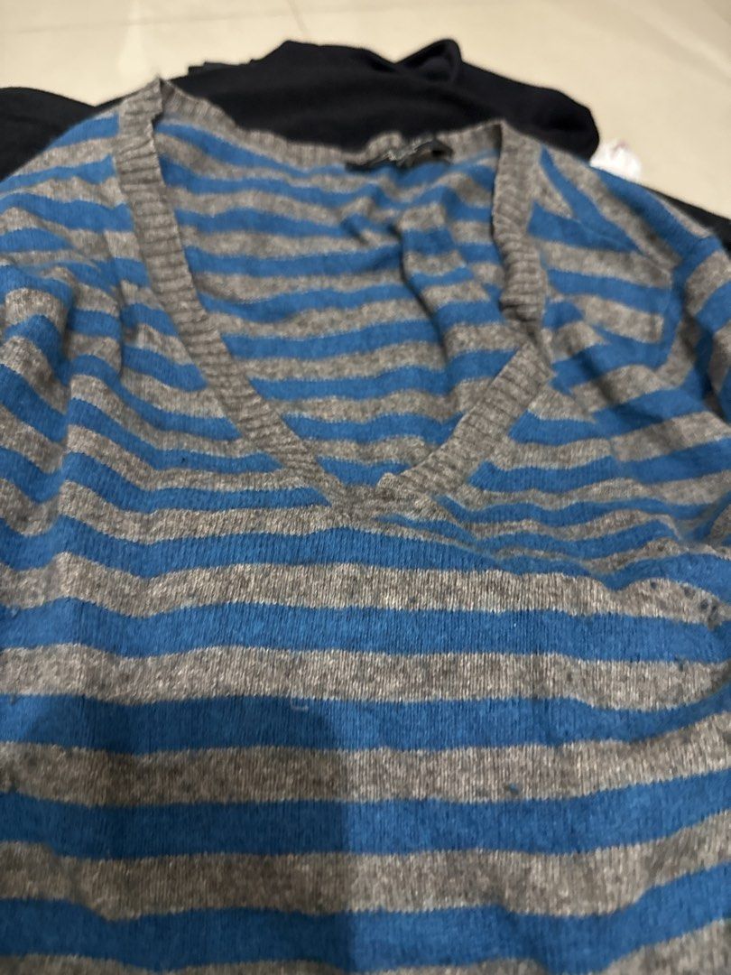 Blue and Grey Striped V-Neck Sweater (Category: Longsleeves) located in Manila. Submitted by hiiipurple (Listing ID 1459795602, Image 2). Description: - Cozy long-sleeved sweater - Blue and grey horizontal stripes - Flattering V-neckline - Comfortable knit fabric - Ideal for layering or standalone wear - Versatile: pairs well with jeans or skirts - Timeless striped design.